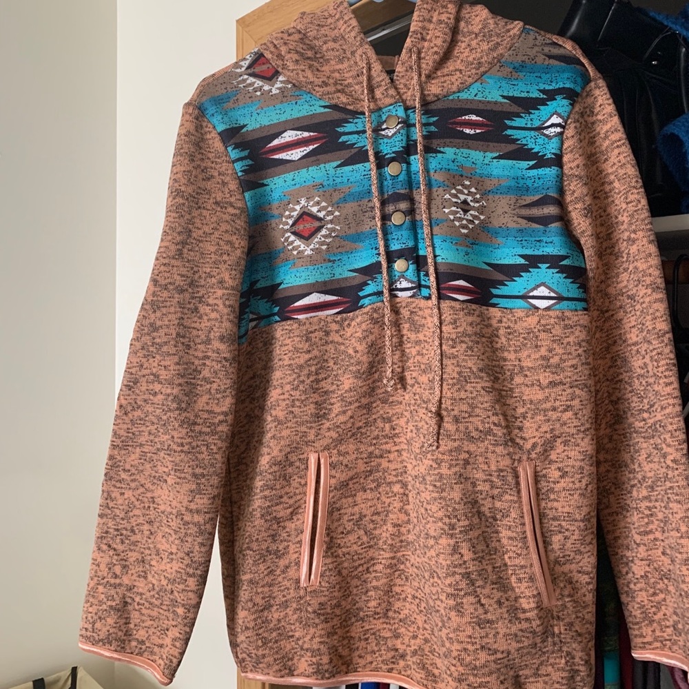 Soft southwest style hoodie, pinkish orange.